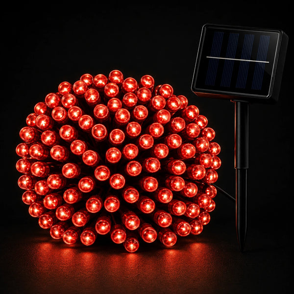 Red string lights with solar panel on a black background