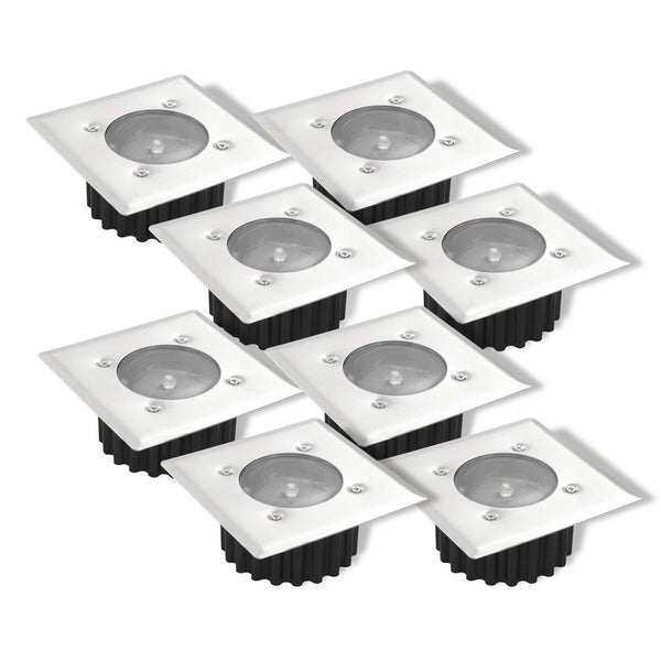A set of four square solar decking lights with a black top and clear base, containing three LED bulbs each.